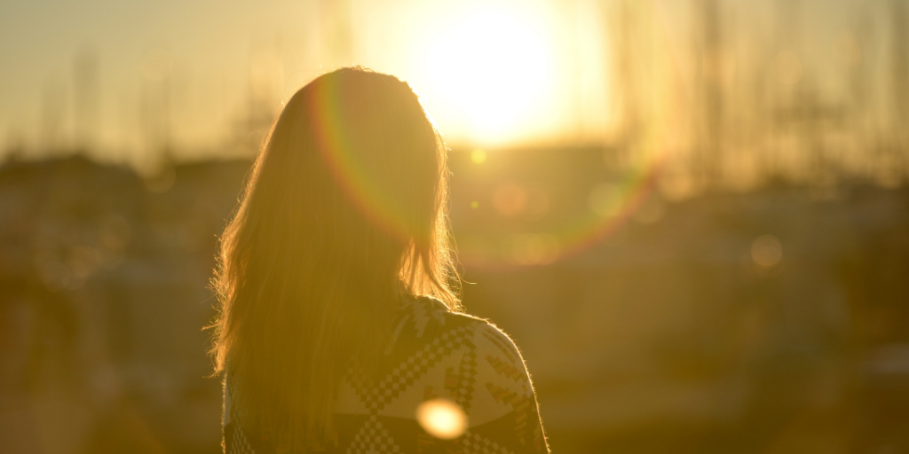 A lady looking at the sunrise, God' new thing